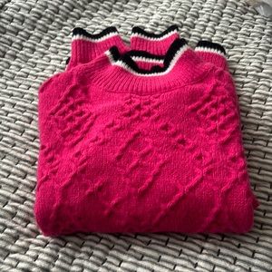 Pink mock turtle neck sweater.
